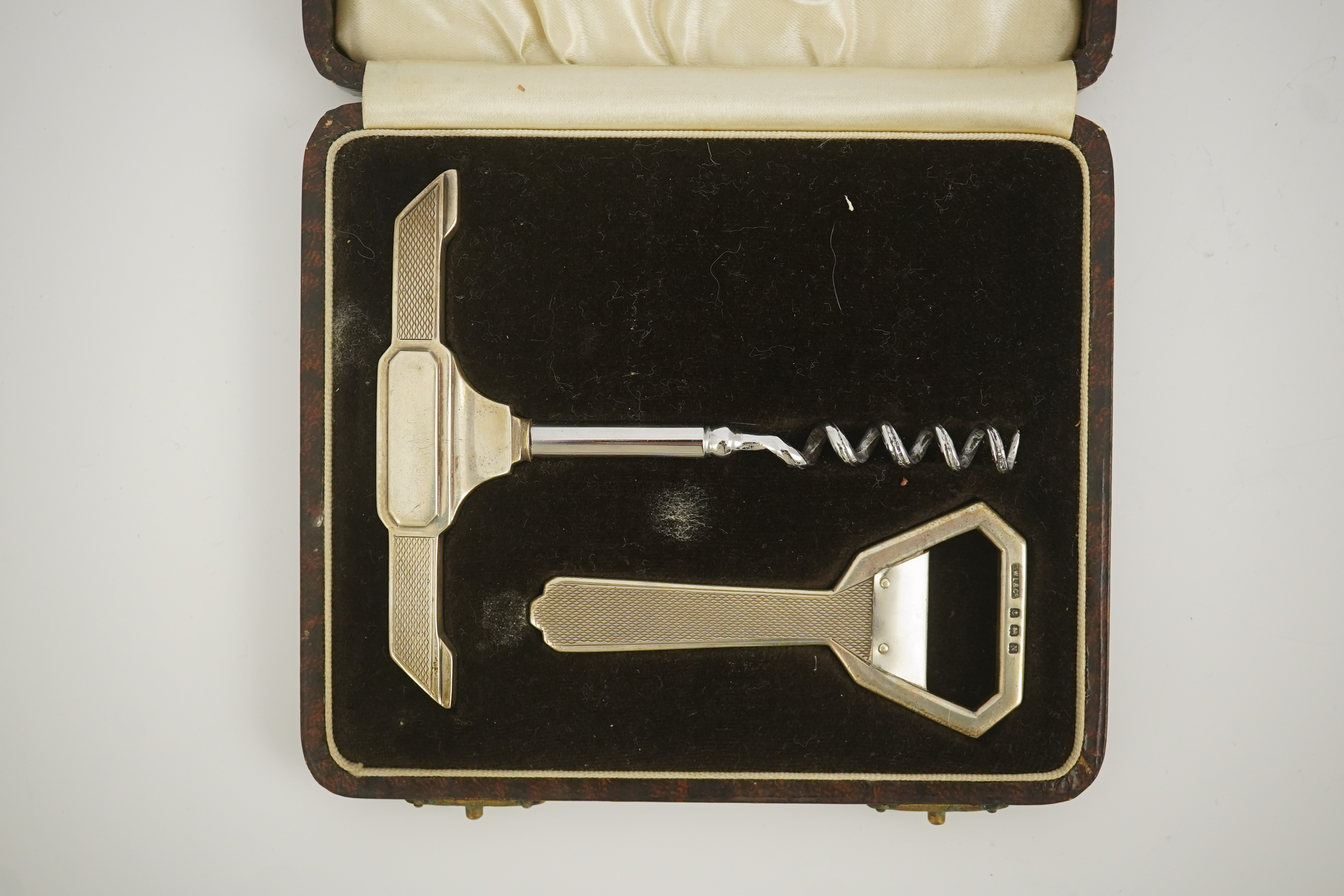 A cased 1930's Art Deco silver corkscrew and bottle opener set, by G.W. Lewis & Co